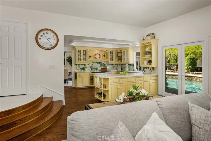 The spacious kitchen enjoys a pool view and opens to the family room, perfect for everyday living or entertaining.