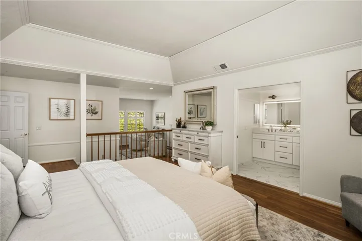 The primary suite is the ideal retreat, with a sitting area complemented by a fireplace, in addition to a newly remodeled ensuite bath.
