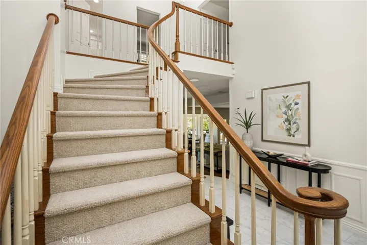 Stairway with new carpeting leads to 4 bedrooms on the second level.