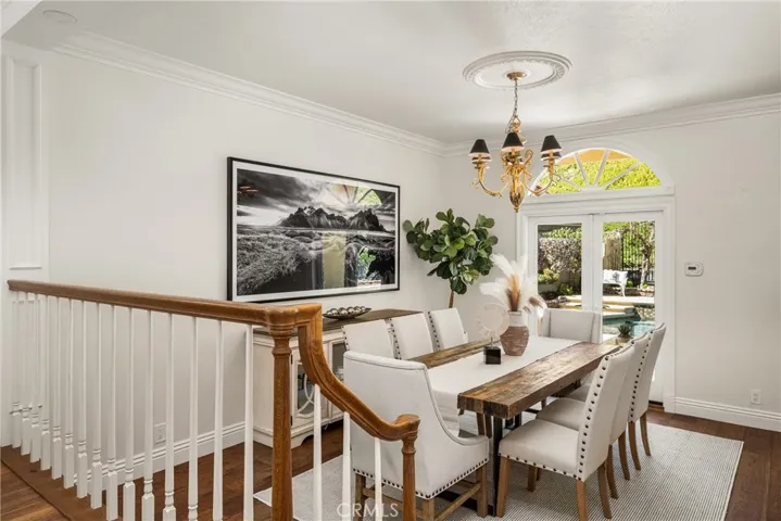 Formal dining room features French doors opening to the backyard, which is ideal for the flow when entertaining!