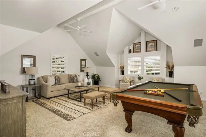 Vaulted ceilings, plantation shutters and built-in speakers, make this an ideal game room or TV/Media space!
