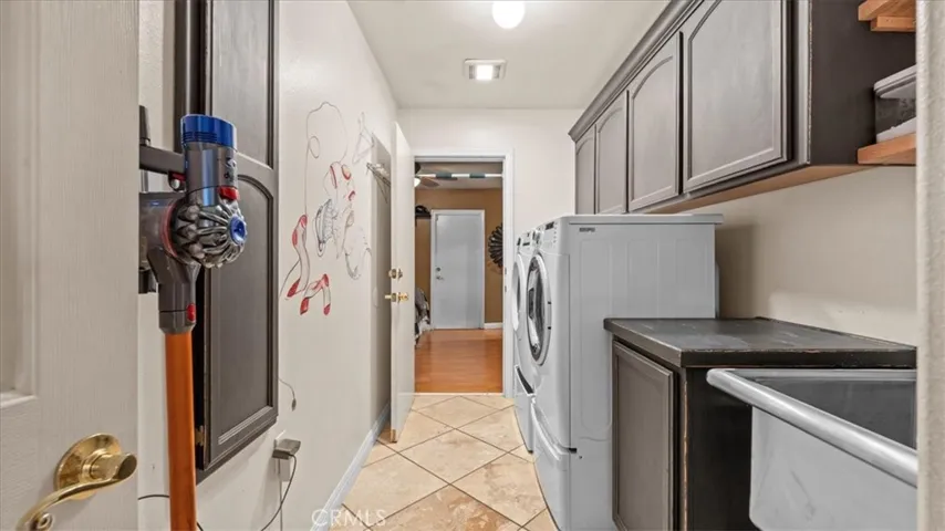 Laundry room that leads into the separate-entry bedroom
