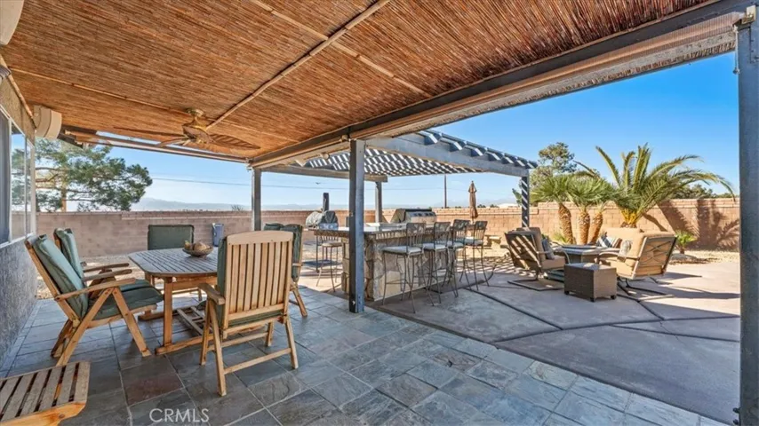 Main covered patio (slate tile):Main covered patio with slate tile flooring and multiple seating areas