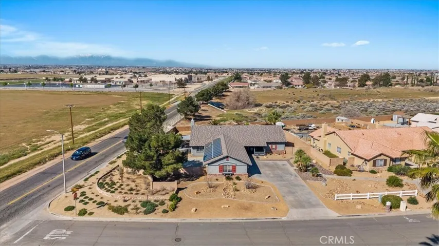 Aerial (full property): Aerial view showcasing expansive lot, corner positioning, and backyard layout