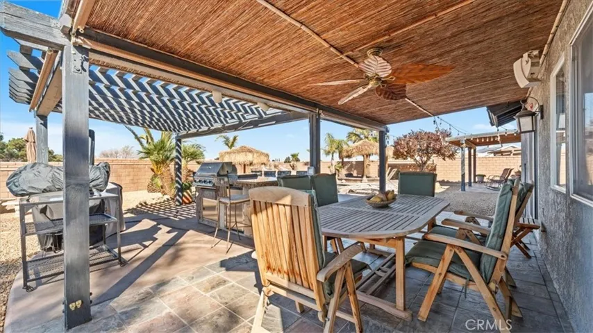 Another angle of main covered patio: Outdoor kitchen setup designed for entertaining and everyday use