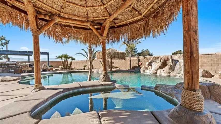 Pool & waterfall/slide: Saltwater pool and spa with rock waterfall and slide feature