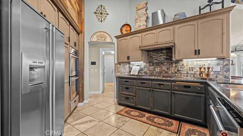 Updated kitchen with oak cabinetry and HanStone Quartz countertops