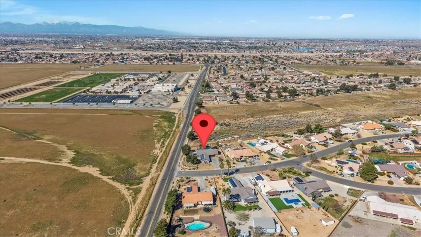 Opposite angle of aerial view with subject property identified