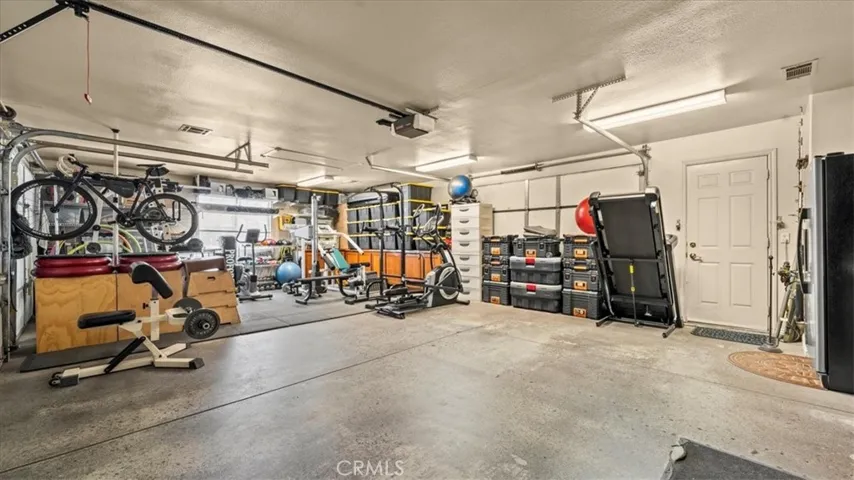 Garage: 3-car garage with ample storage and workspace potential