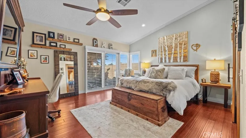 Primary bedroom: Primary suite with bamboo flooring and upgraded finishes
