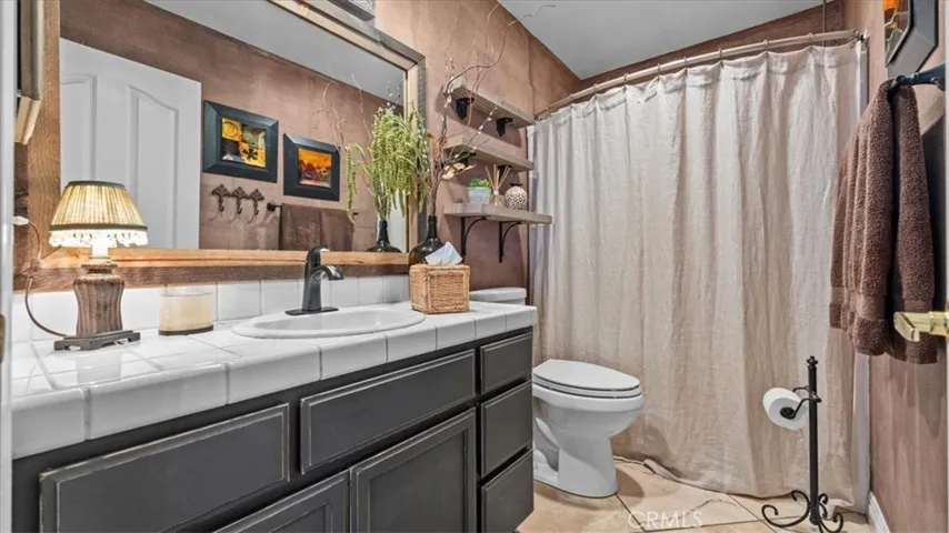 Guest bathroom with updated tilework and clean, modern finishes