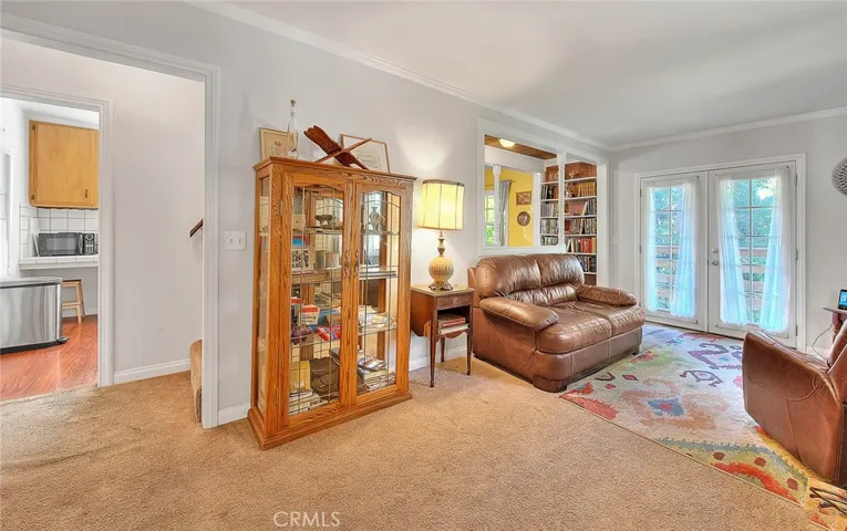 Spacious family room leads to the kitchen, outdoor deck and upstairs loft.