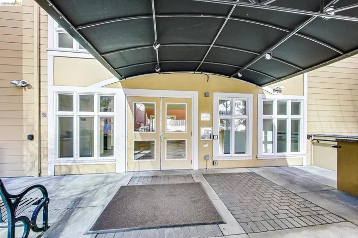 Doorway to property with a patio area