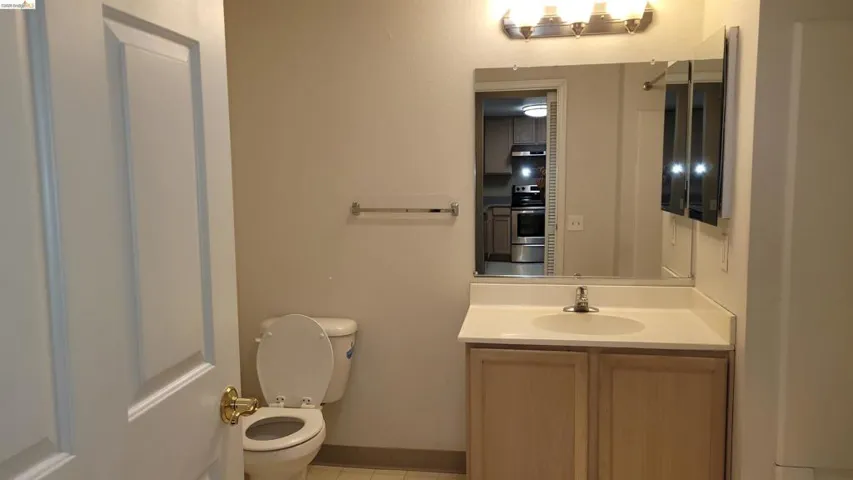 Half bath featuring toilet and vanity