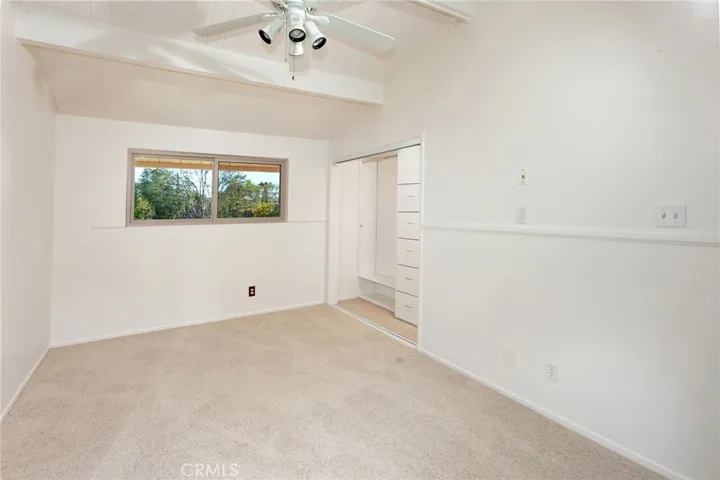 Upstairs, you will find three additional bedrooms, all freshly painted with new carpet, wood plank ceilings, ceiling fans, mirrored closet doors, and closet organizers. One of the upstairs bedrooms offers a natural option for a primary bedroom, located adjacent to the bathroom for a comfortable and practical retreat.