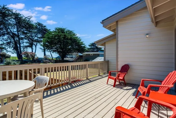This sunny back deck is accessible from both the living area and the primary bedroom.