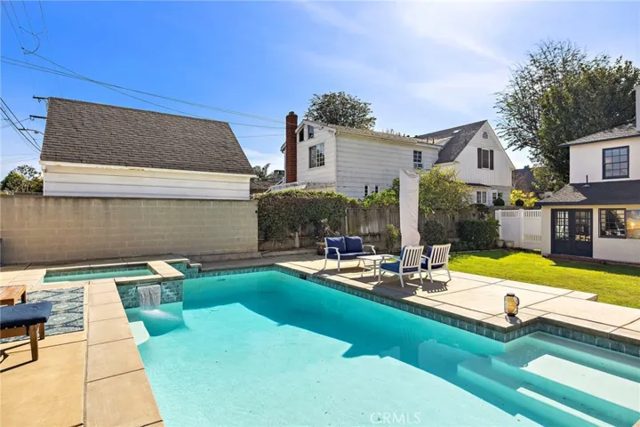 The spa has two beautiful spillover features in to the pool.