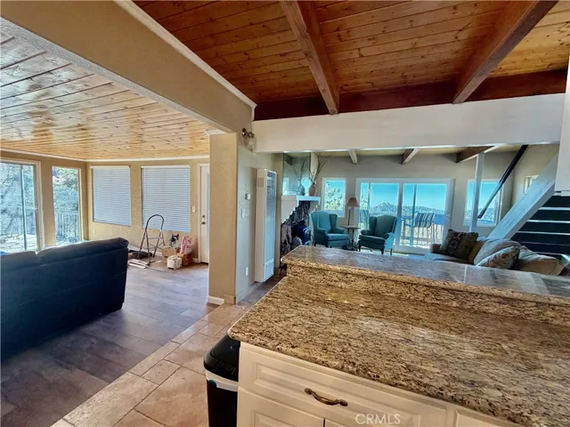 Kitchen open to living room and family room or dining area.