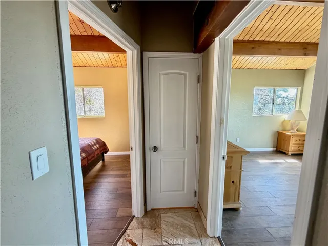 Hallway with linen closet.