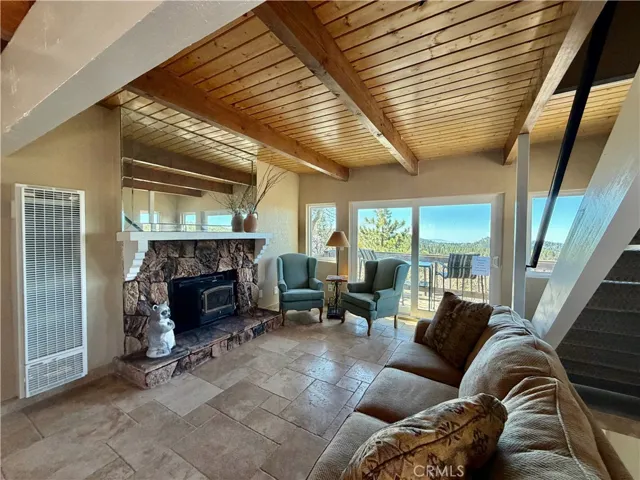 Main floor living room with slider to deck with view.