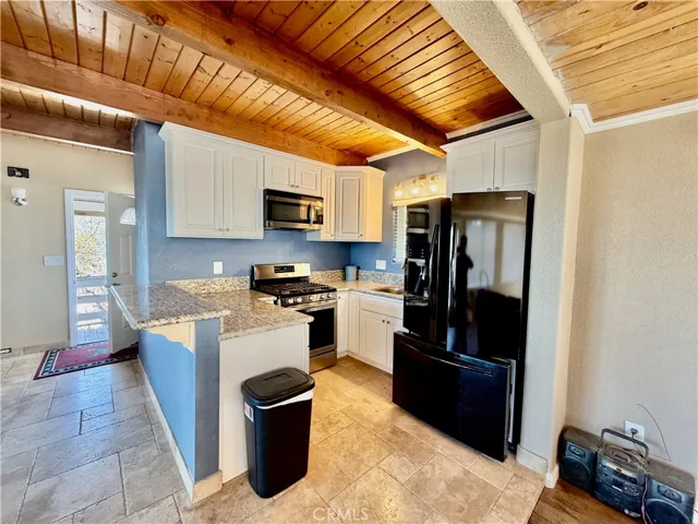 Kitchen with granite counter tops.