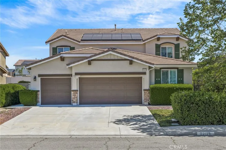 Beautifully maintained two-story home featuring great curb appeal, a spacious driveway, and a 3-car garage. The exterior showcases a modern neutral color palette with stone accents, manicured landscaping, and mature trees for added privacy. Equipped with solar panels for energy efficiency, this home offers both style and sustainability. Located in a well-kept neighborhood, this property is ideal for buyers seeking comfort, functionality, and long-term savings.