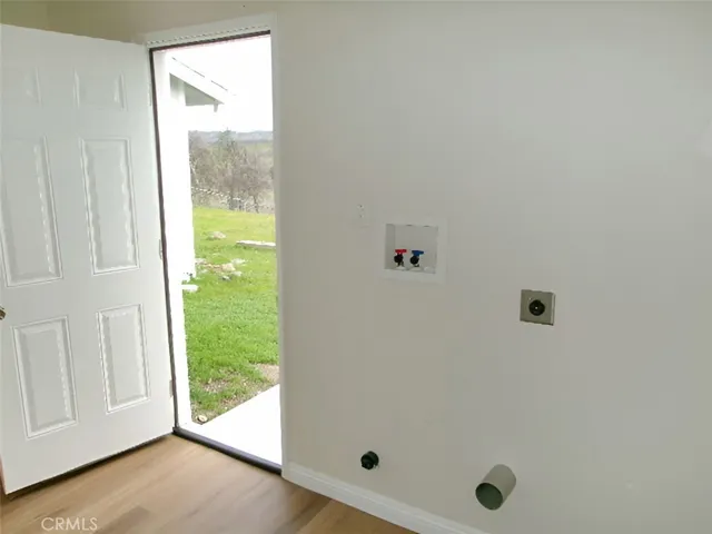 laundry room with door to rear