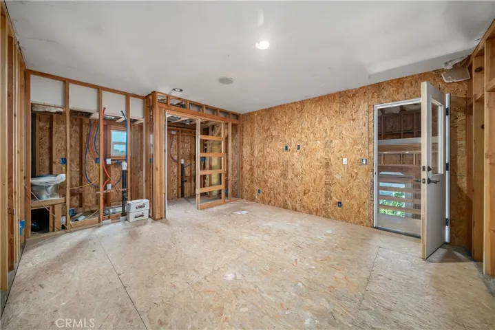 Unfinished lower level with plumbing and electrical. Downstairs bathroom and shower plumbed in.