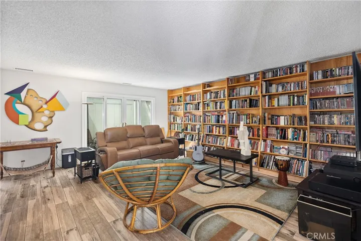 Beautiful custom shelving in front room, primary living space