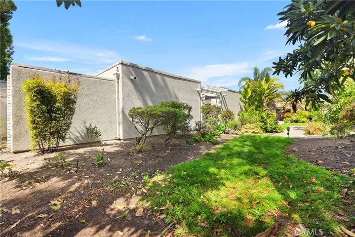 Side of home w/ maintained vegetation