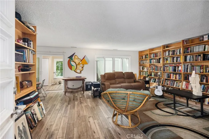 Front room looking out to rear patio & office/ 3rd bedroom