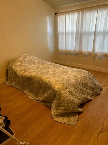 Principal Bedroom with wide window to front garden.