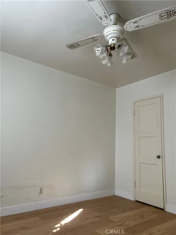 Ceiling fan lamp at Second Bedroom and door to closet.