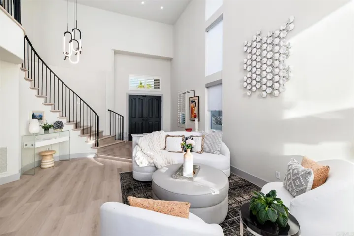 Living Room & dinning Room have soaring ceiling with windows to match