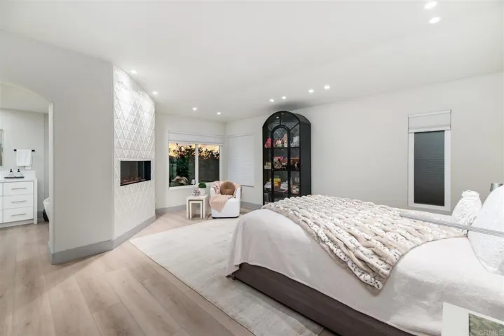 Main bedroom has electric fireplace that warms both the bedroom and bathroom
