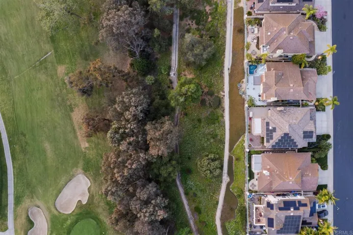 There are two pathways behind the community Trees line the pathways for privacy from the golf course