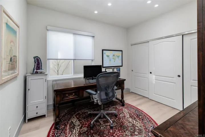 Downstairs bedroom is being used by seller as an office