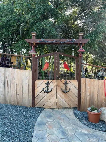 Gate to patio, picnic table, garden