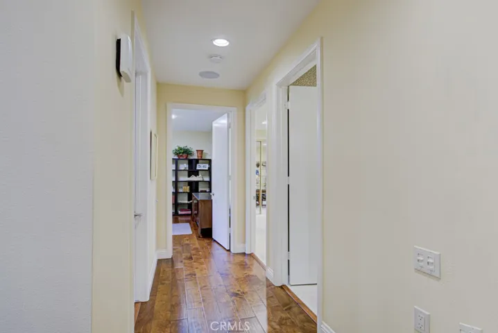 Hallway leading to guest bedrooms and bathroom and laundry room.