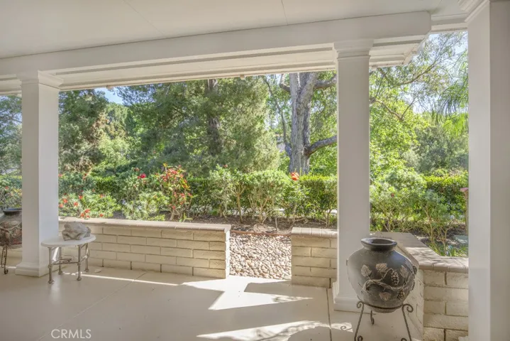 Huge covered outdoor patio is over 400 sq. ft! It offers a lovely panoramic view of mature trees and is ideal for year-round entertaining, dining and relaxing.