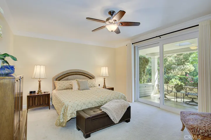 Primary bedroom suite is enormous and easily accommodates a king-size bed and large furnishings. This bedroom has direct access to the covered rear patio.