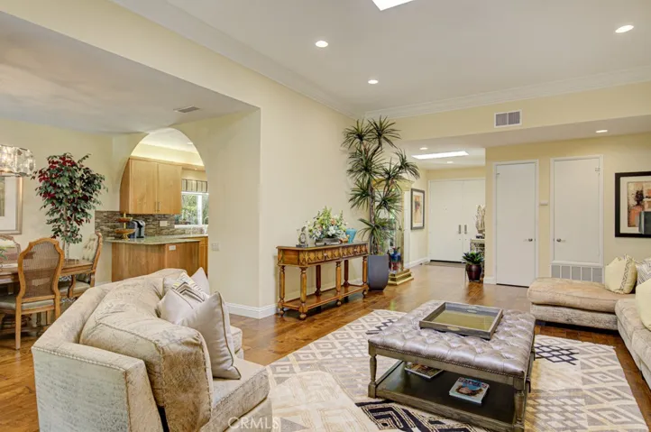 Another view of the living room looking back towards the front entry. Kitchen and dining room can be seen at left.