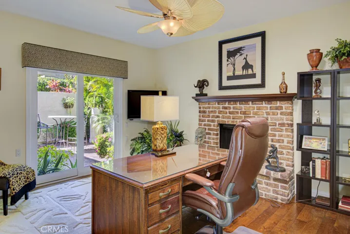 Guest bedroom #2 is currently used as an office. It has a gas fireplace and direct access to the front courtyard.
