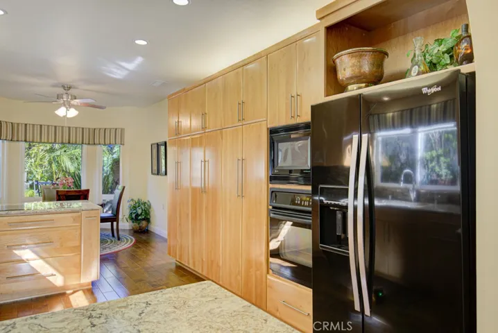 Another view of the kitchen. Breakfast nook can be seen at left.