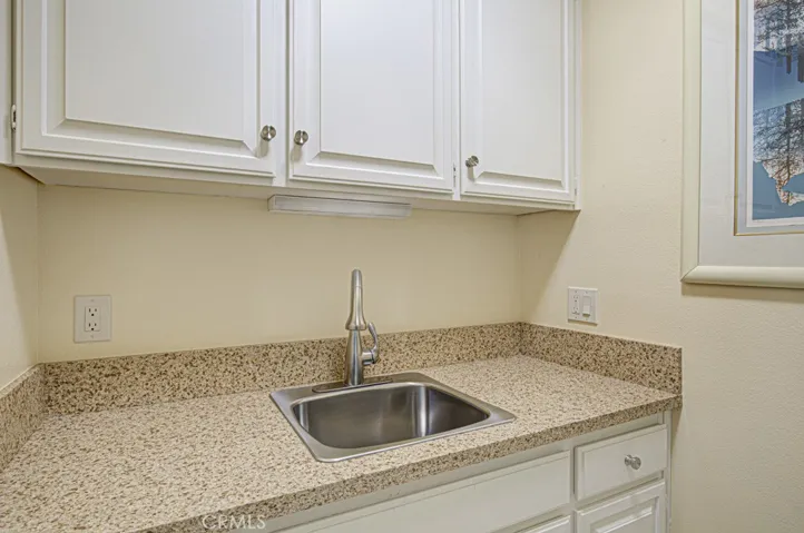 Utility sink in laundry room.