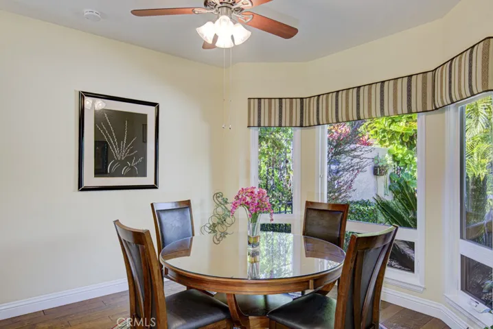 Breakfast nook in the kitchen looks onto the front courtyard.