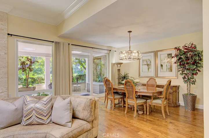 View of the dining room from the living room. Glass slider opens to the large covered rear patio.