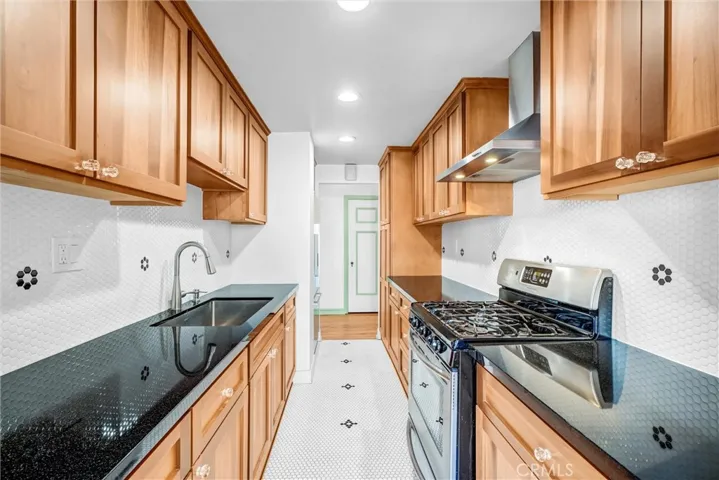 Remodeled kitchen with custom cabinets, granite counter tops and vintage inspired tiles.