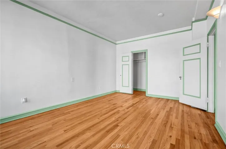 Spacious bedroom with walk-in closet.