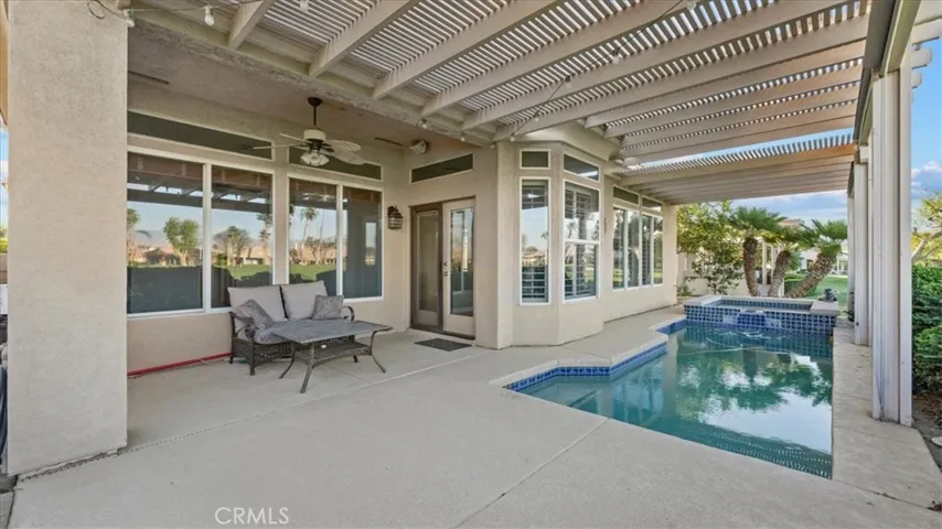 Very Spacious covered back patio with sun shades that can be lowered when necessary
